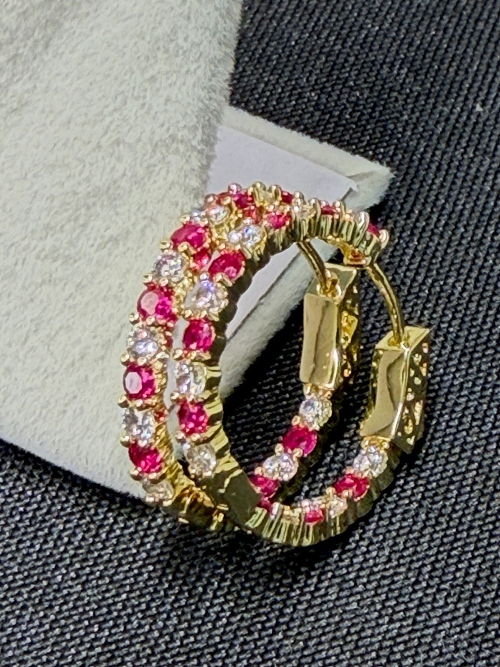 18 karat triple plated gold, pink and white stone lockable medium hoop earring.
